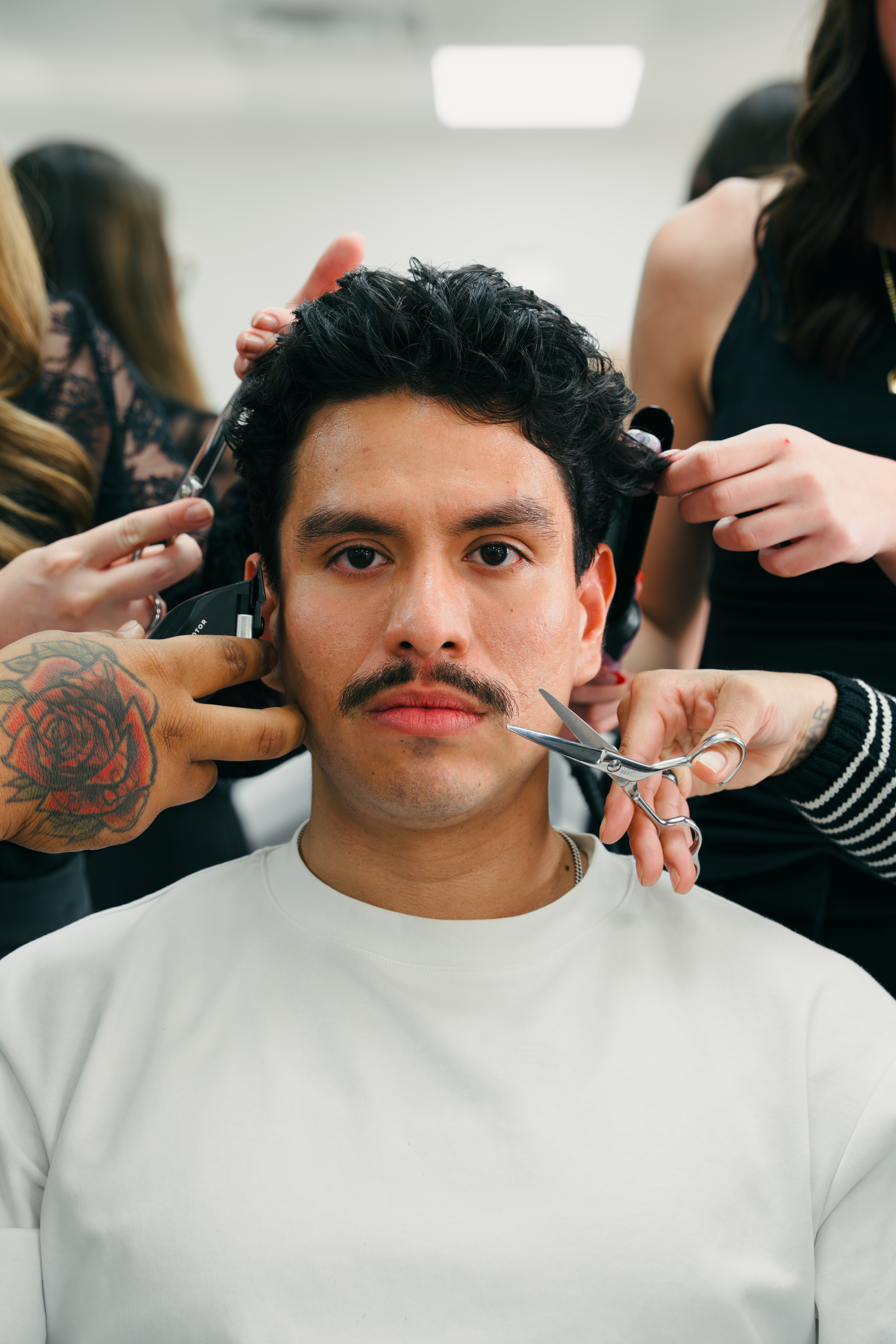 Inspire Hair Studio Barber using scissors