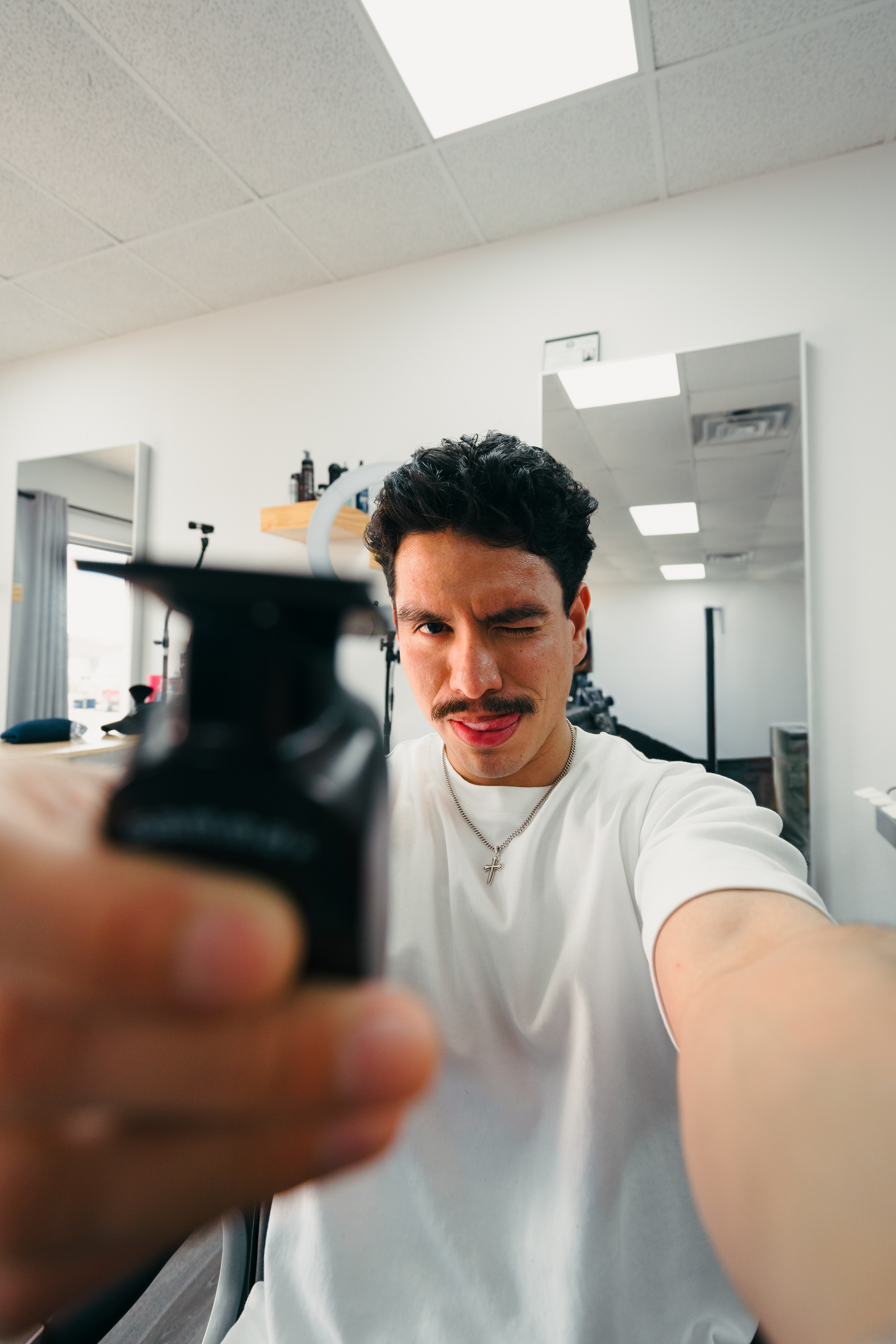 Barber holding clippers